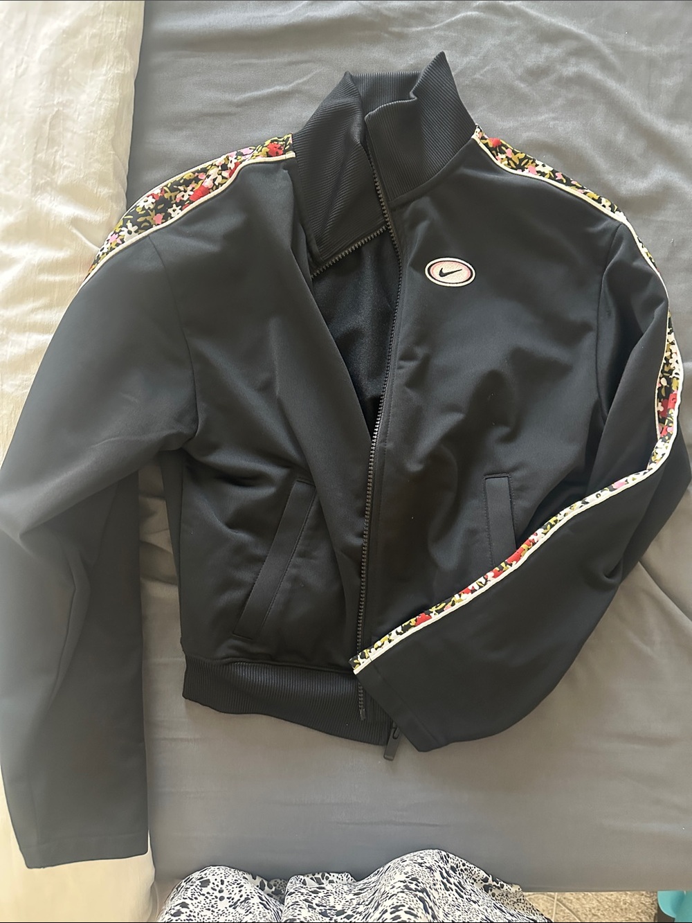 Nike Women's Black Track Jacket with Floral Trimed Stripe